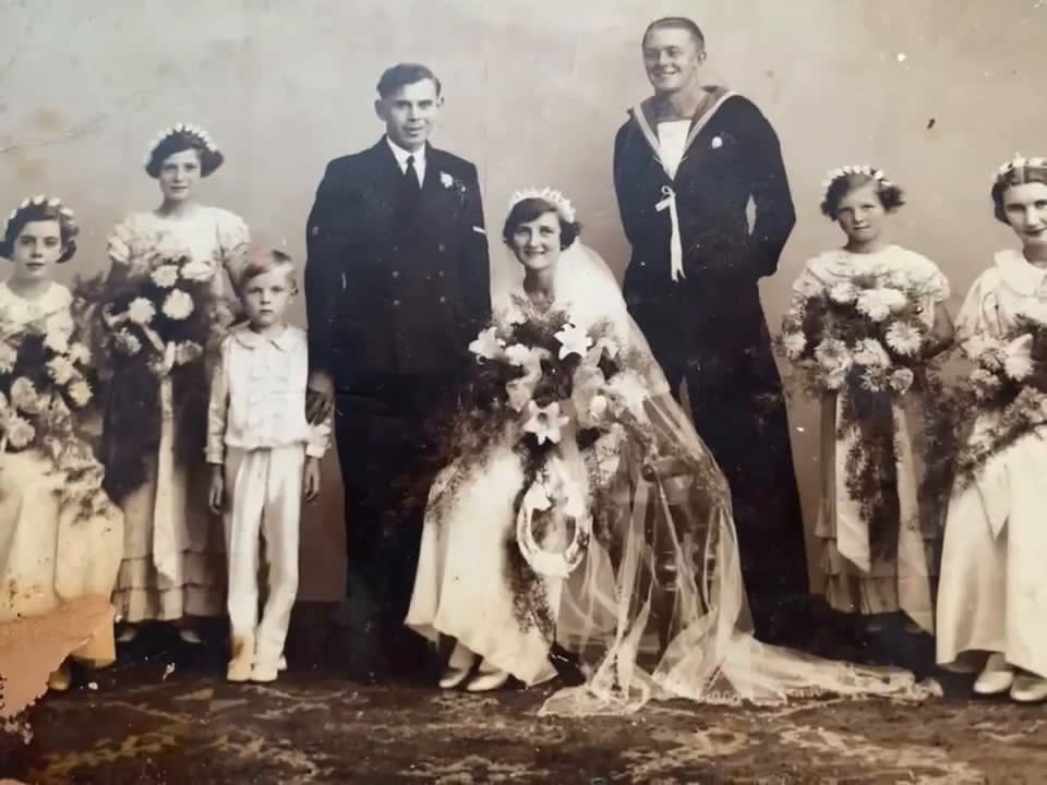 Wedding group photograph; William P. Barlow in naval uniform, standing to the left of the bride